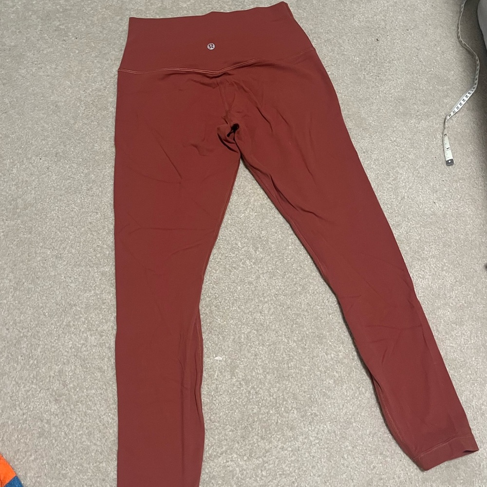Burnt orange colored lululemon leggings